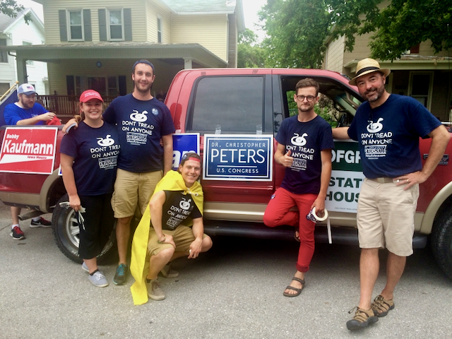 Chris Peters with volunteers beside a campaign truck